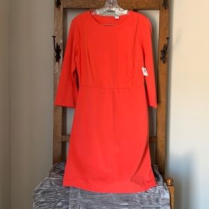 Women’s coral colored dress, new with tags. Size medium